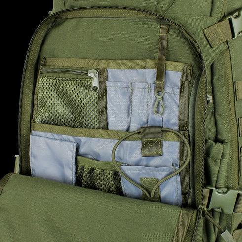 Close-up of the Condor Venture Backpack 27.5L in Scorpion OCP, ideal for bushcraft or shooting range use, showing its open pocket with multiple interior compartments, mesh and fabric pockets, plus an internal key clip.